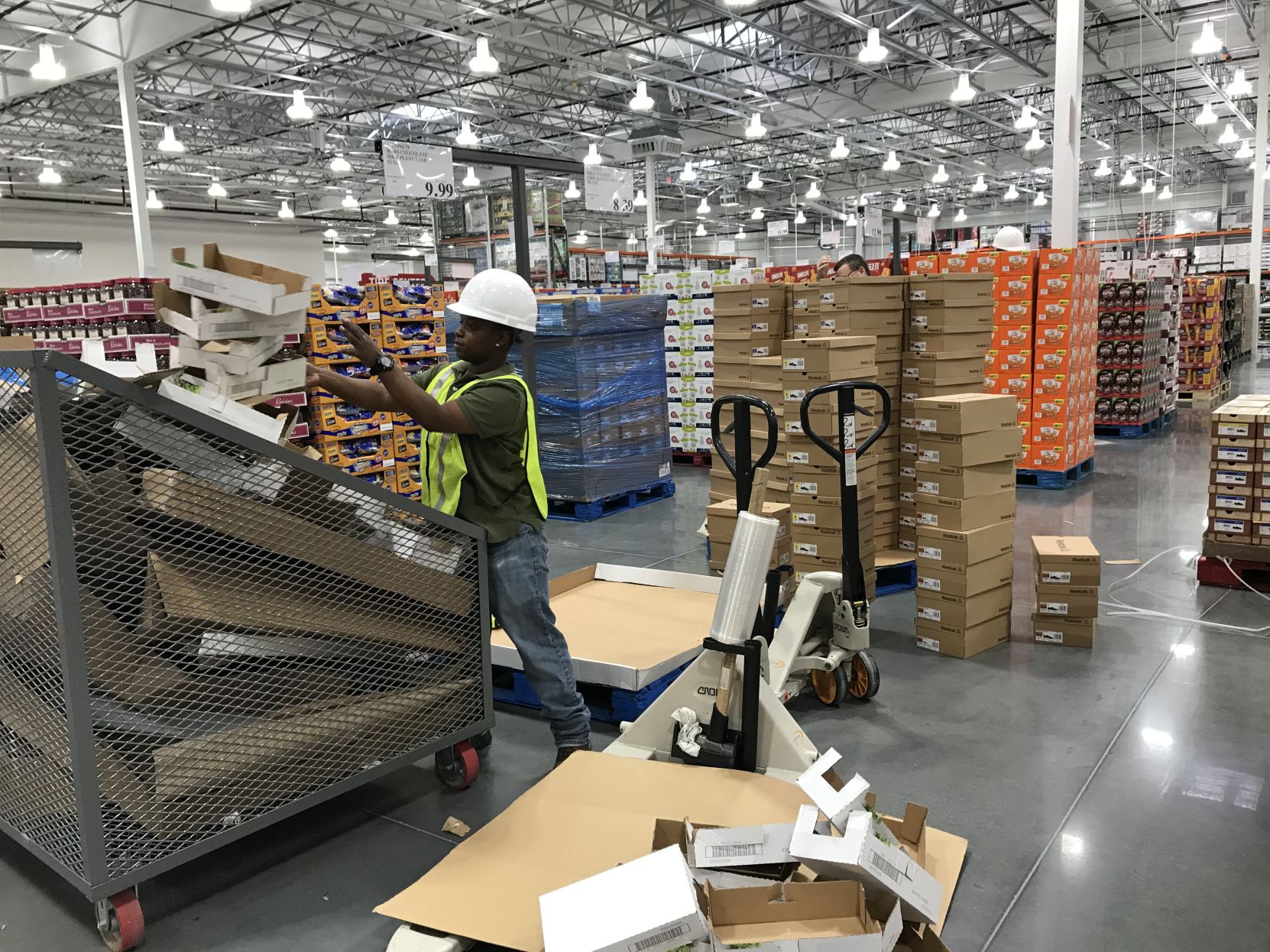Costco employee Gina Agee stocking new store